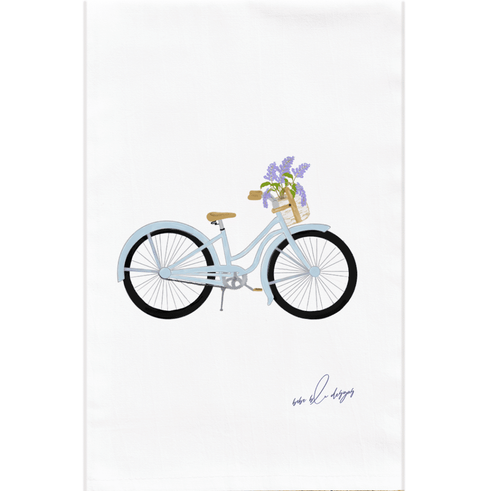 bike with basket of lilacs on a flour sack tea towel