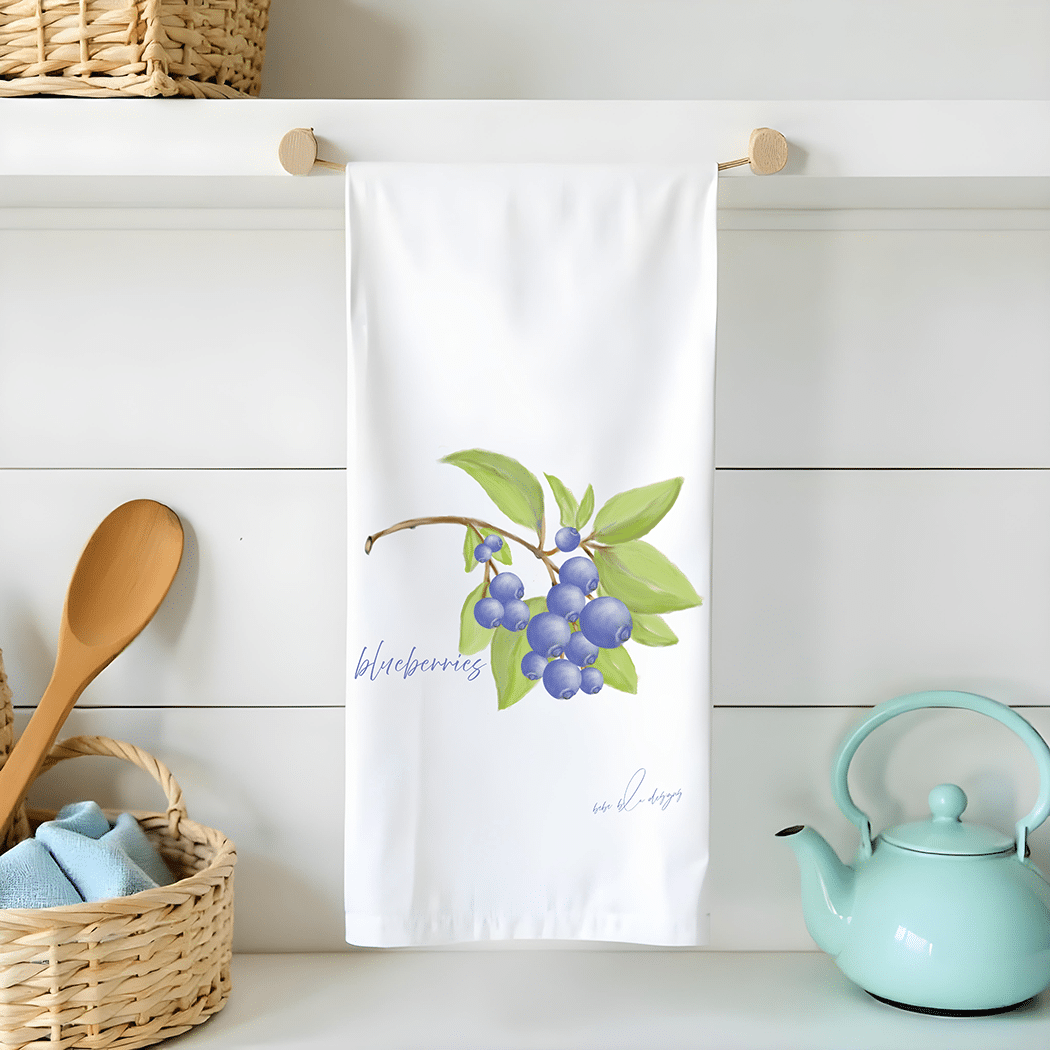a bunch of blueberries on a flour sack tea towel