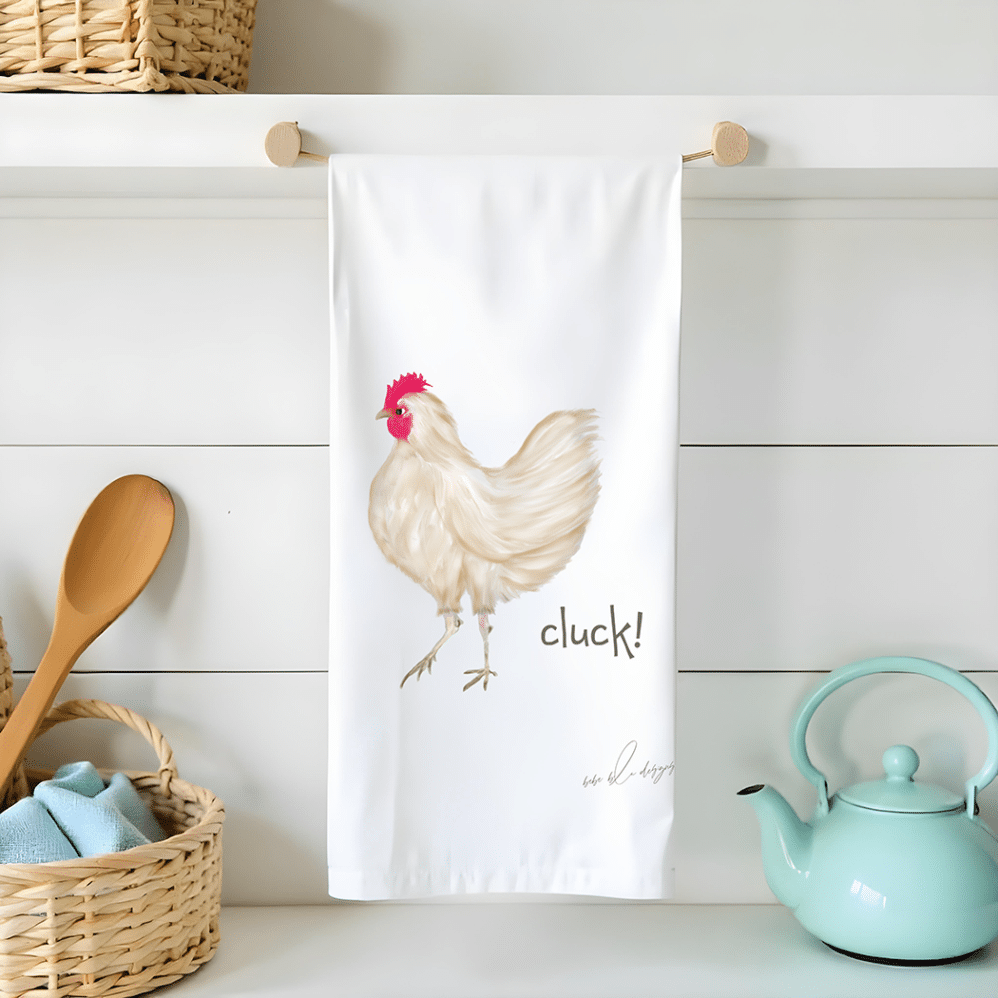 brown chicken flour sack tea towel with the wording...cluck