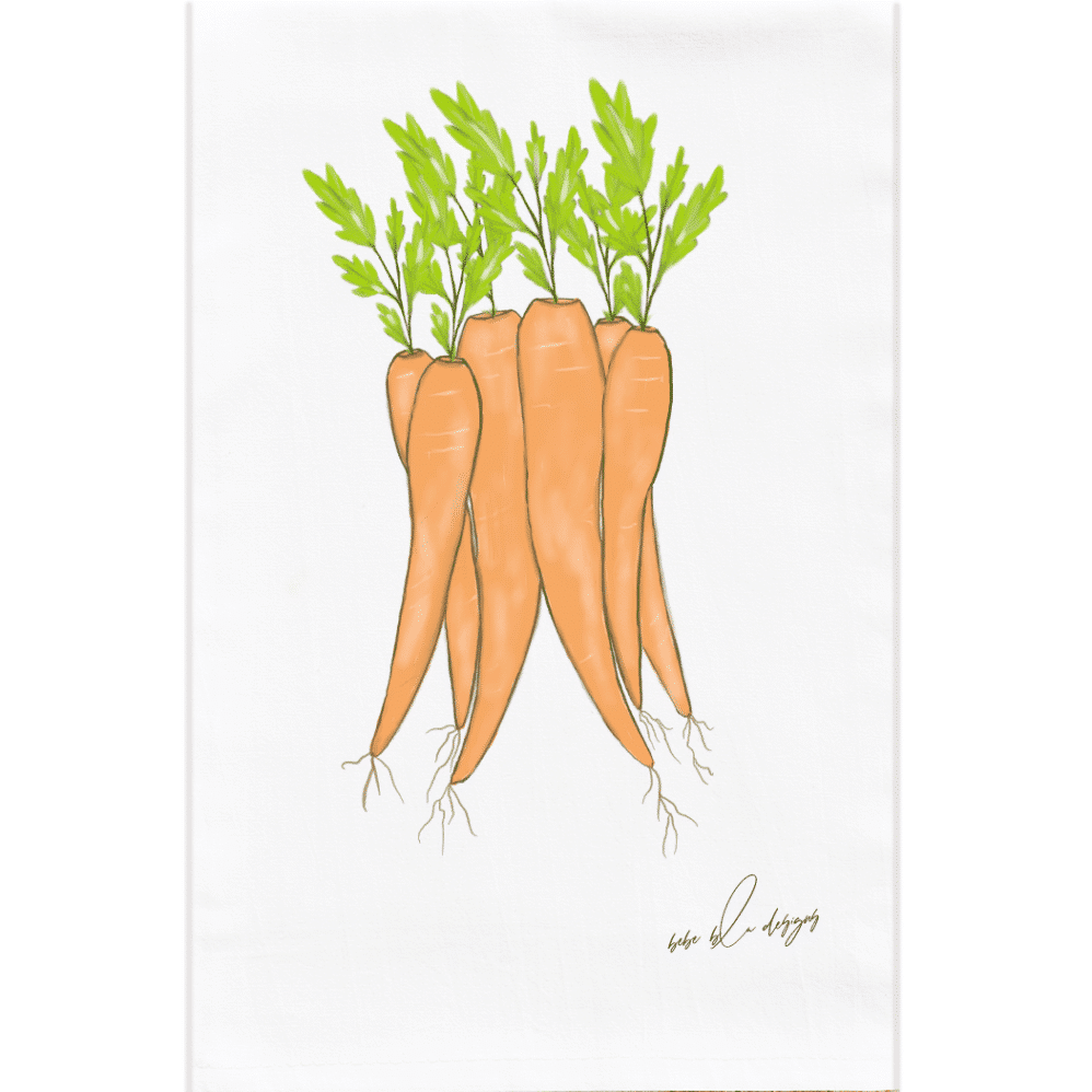 carrots with green stems on a flour sack towel
