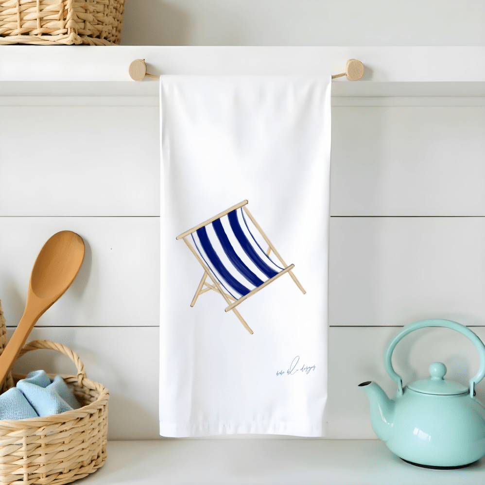 a blue and white stripped deck chair on a flour sack tea towel