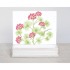 a bunch of red and geraniums with soft green geranium leaves on note cards