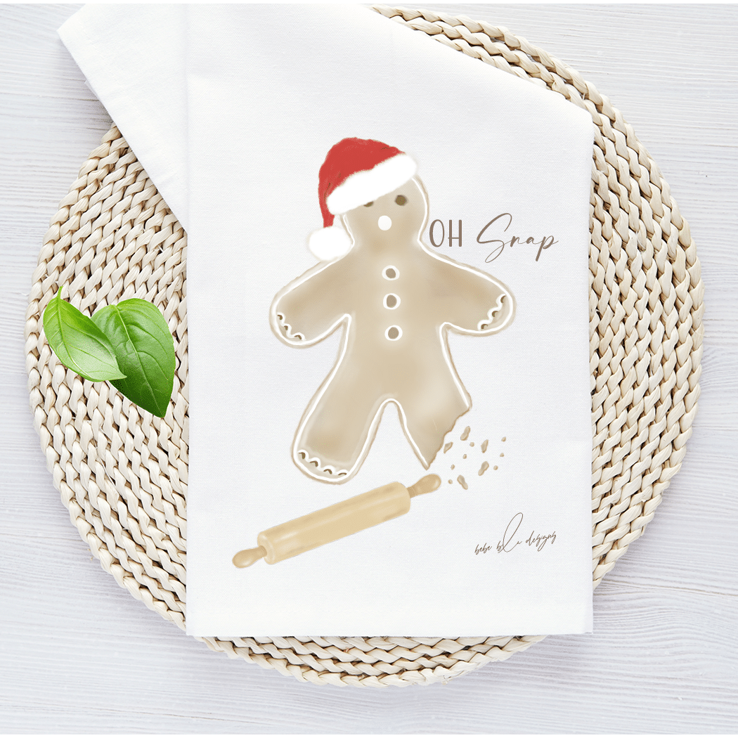 gingerbread man with a bite out of his leg and the words...oh snap. Included is a wooden rolling pin help to make this an adorable kitchen towel