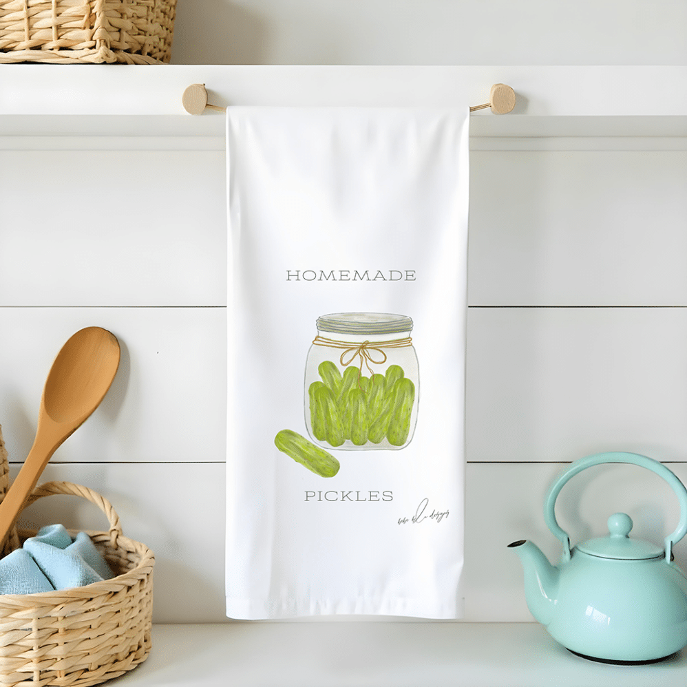 a jar of homemade pickles on a flour sack tea towel