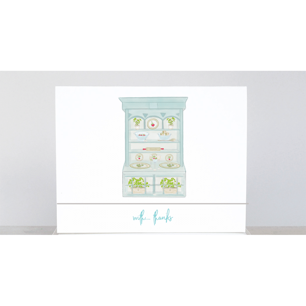 The blue kitchen cupboard thank you note filled with cute kitchen essentials in the cupboard