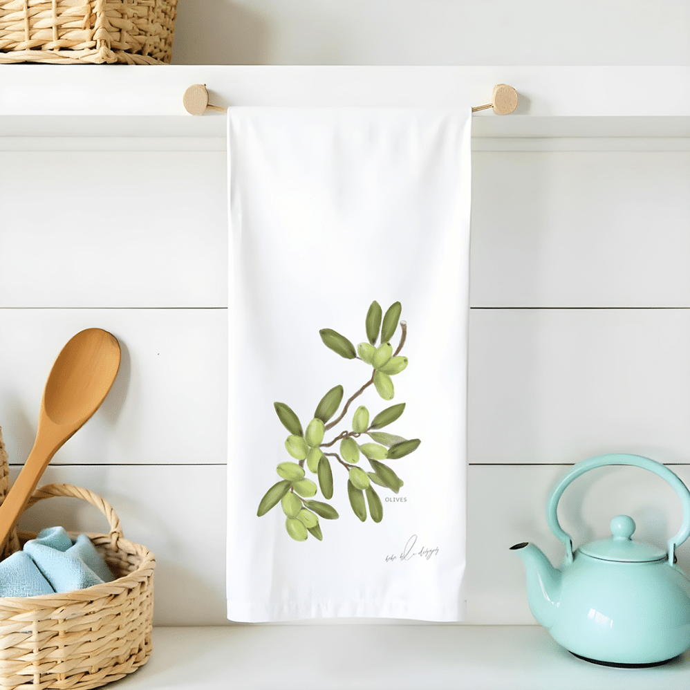 green olives on a flour sack tea towel