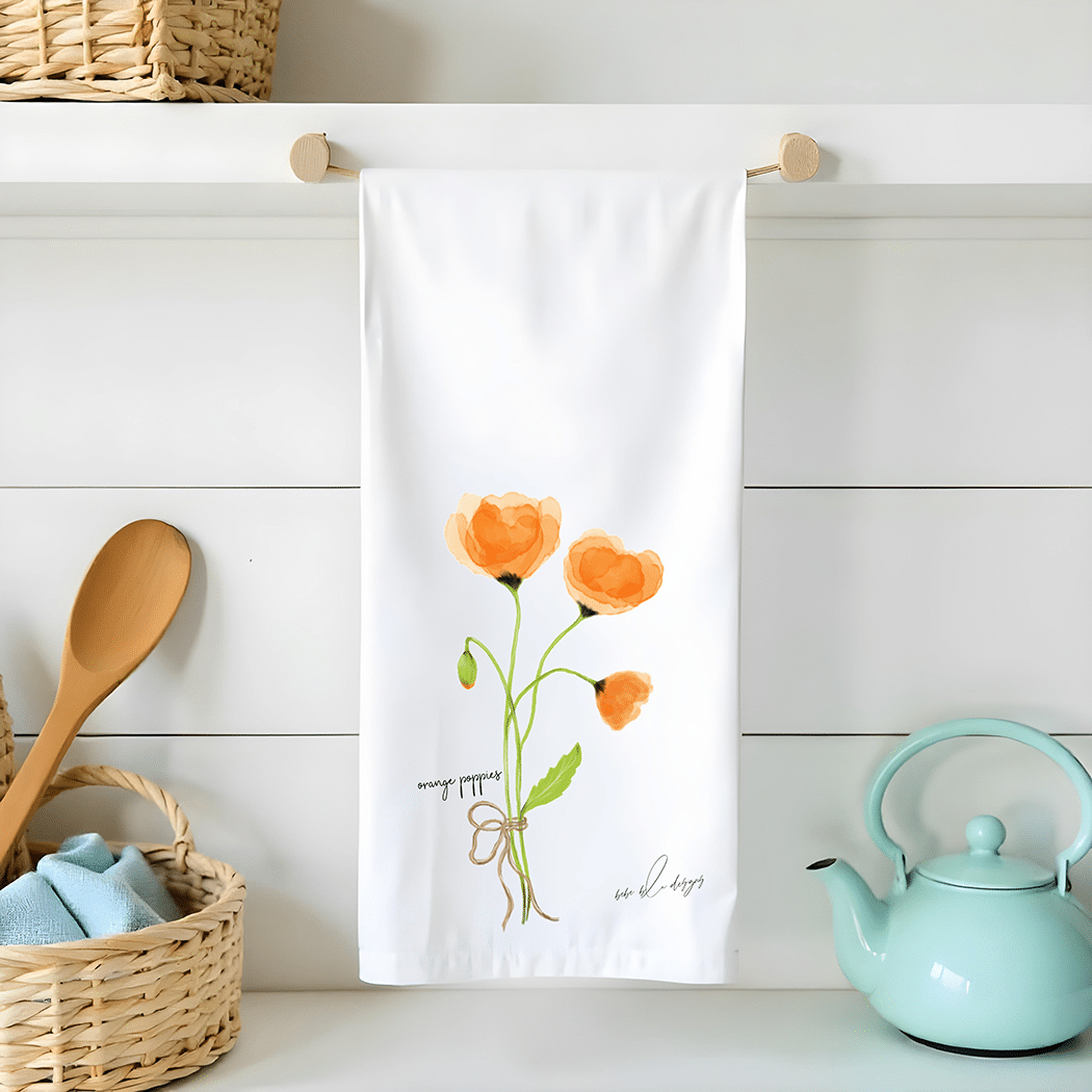 orange poppy bouquet on a flour sack tea towel