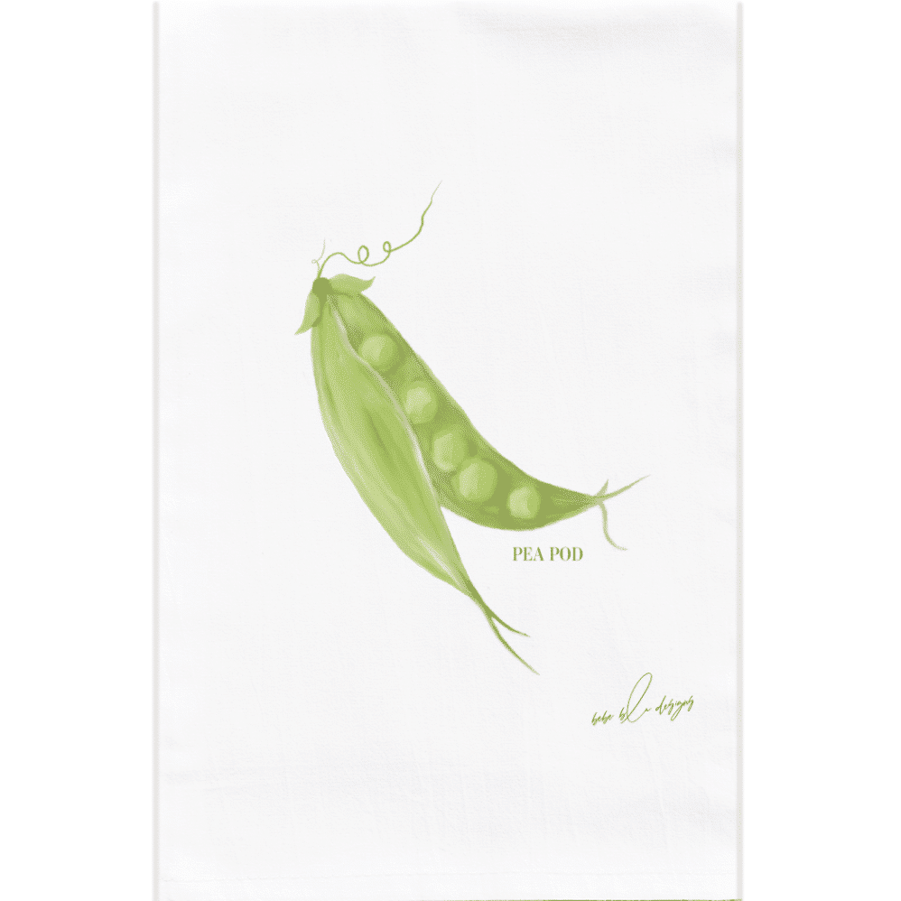 An open pea pod on a flour sack towel