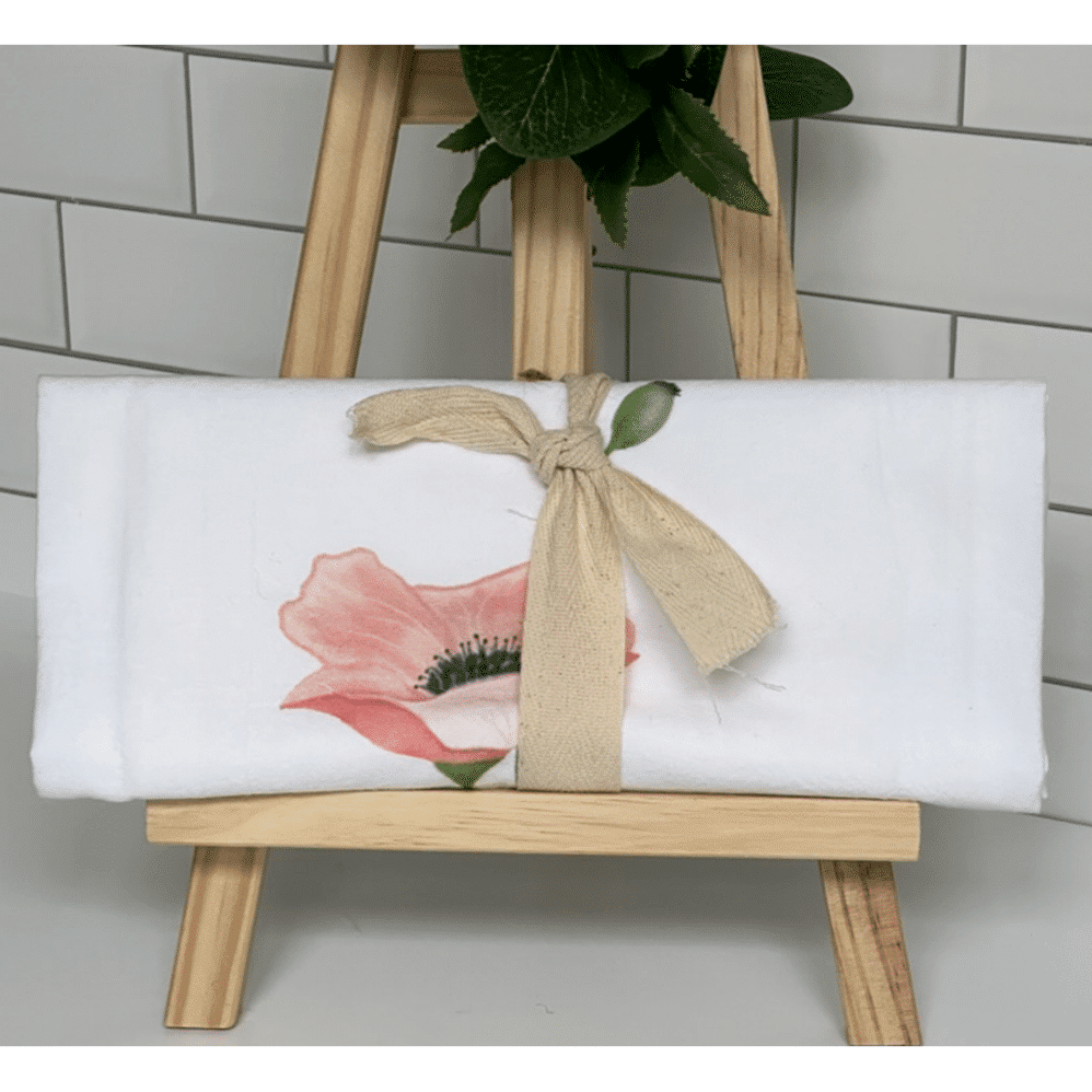 pink poppy flour sack towel wrapped