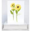 two stems of yellow sunflowers on note card