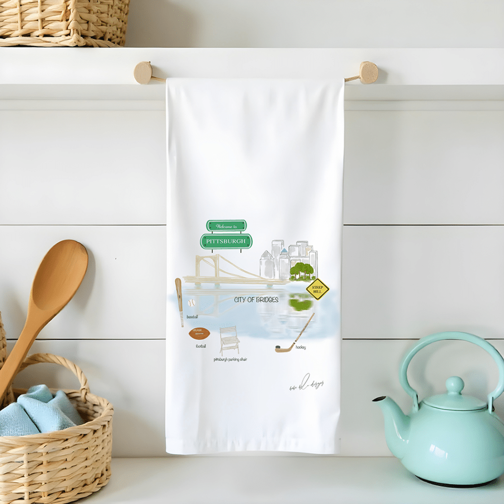 Welcome to Pittsburgh flour sack towel featuring the skyline reflecting in the water and things Pittsburgh is known for; baseball, hockey, football, steep hills and the Pittsburgh Parking Chair.