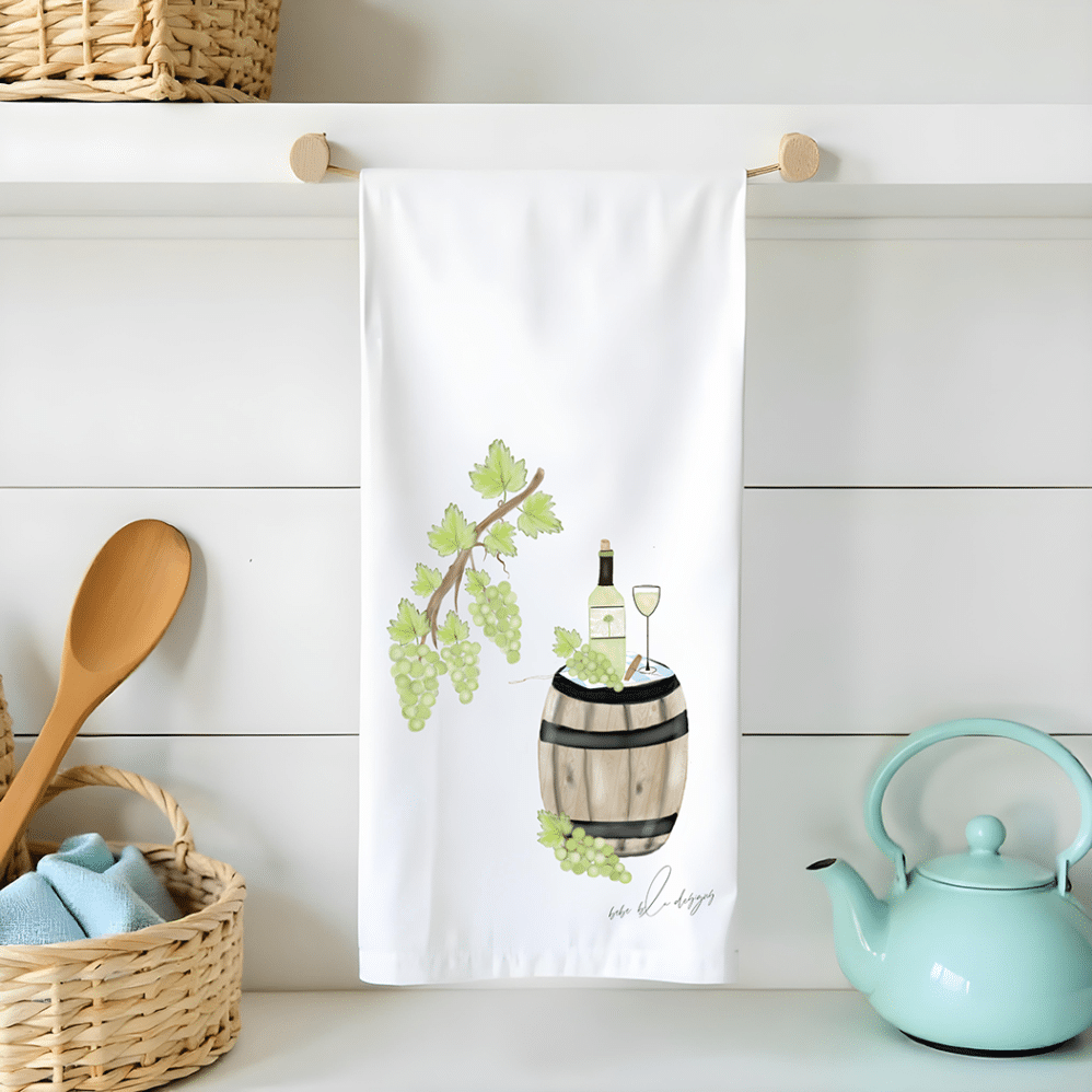 wine barrel with wine and grapes on a flour sack tea towel